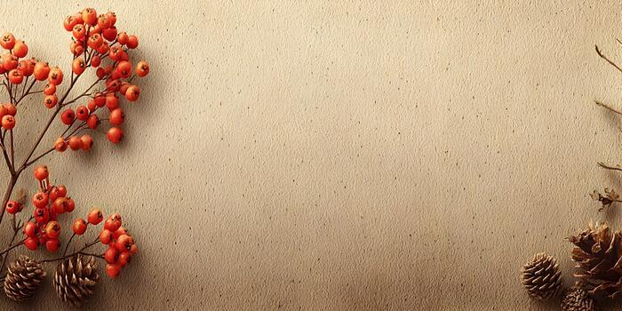 A branch with red berries and pine cones is arranged on a textured beige background with copy space photo