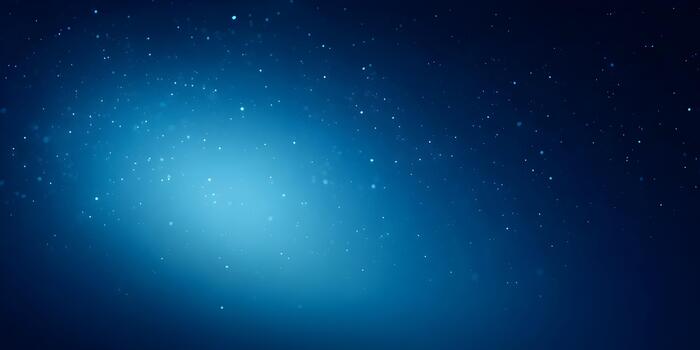 Shimmering light particles float across a deep blue abstract background creating a magical effect photo