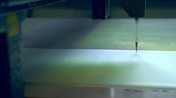 Making picture on the glass part of the door. Thin sharp instrument moves along drawing line. Close up. video