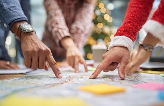 Diverse Team Mapping Holiday Routes Together photo