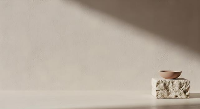 Minimalist beige background with rustic stone pedestal and ceramic bowl creating a serene neutral scene photo