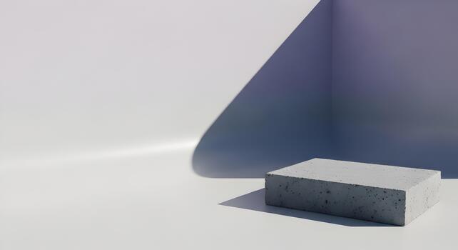 Minimalist concrete block presentation on white surface with corner shadows and modern geometric composition photo