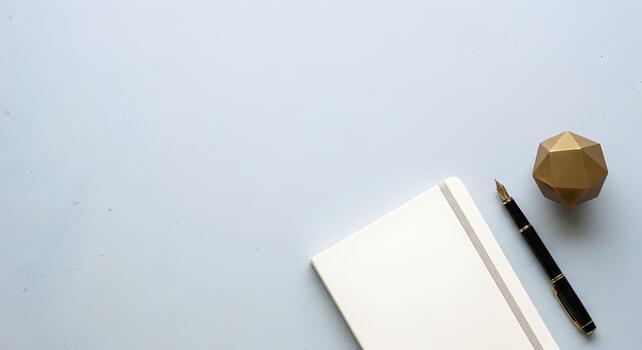 Minimalist Workspace Flat Lay Featuring Notebook Pen and Geometric Object for Creative Projects photo