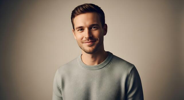 Portrait of a handsome young man with a warm and friendly smile posing confidently photo