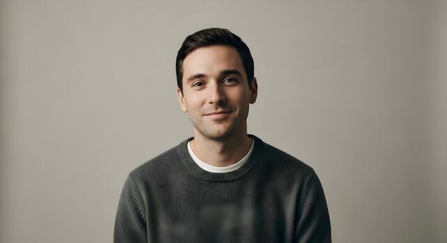 Portrait of a young man with a calm expression in a studio environment photo