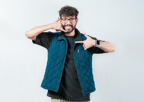 Handsome man gesturing CALL ME in sign language isolated. Person making gesture CALLING in nonverbal language photo