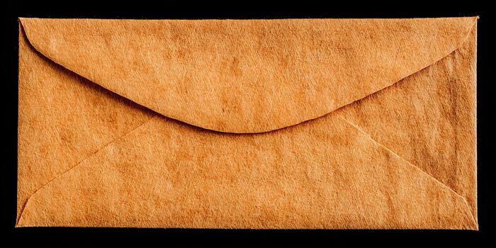 A rustic orange brown paper envelope with a visible fibrous texture is isolated on a black background photo