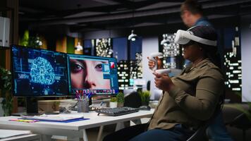 African american woman uses VR headset and AI to edit photos, retouching content and generating professional materials. Graphic editor turning text to image with virtual reality. Camera A. video