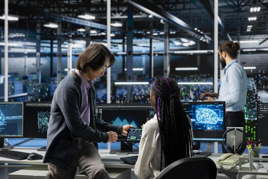 Data center manager teaching intern how to run AI forecasting simulations, tracking performance. Server hub supervisor helping trainee learn to integrate machine learning APIs into software platforms photo