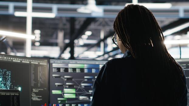 Data center system administrator using node tree software to analyze datasets. Server room IT professional using visual programming tools to improve infrastructure performance, camera B photo