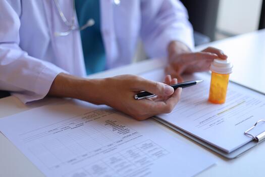 Doctor or General practitioner explain to patient how to use prescribed medicine correctly by explain dosage, frequency, and timing photo