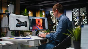 IT engineer checks AI game lobby and turbine to develop a new application, futuristic spaceship game. Neural network powered software uses machine learning to generate game tools. Camera A. video