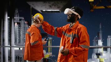 ingenjörer med vr glasögon på offshore olja plattform använda sig av virtuell verklighet tech till simulera borrning operationer och övervaka maskineri, säkerställa säkerhet protokoll i petroleum extraktion. kamera b. video