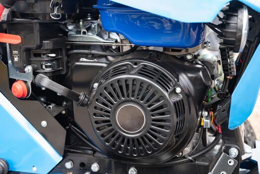 Close-up of an automotive alternator in an engine compartment. photo
