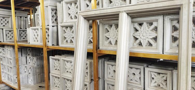 Building materials displayed in a manufacturing or storage area. Decorative concrete ventilation blocks photo