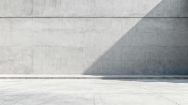 Minimalist architecture features a textured gray wall casting a dramatic diagonal shadow across a flat floor photo