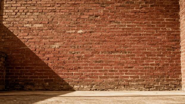 Weathered reddish-brown brick structure illuminated by bright sunlight creating strong shadow patterns photo