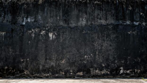 Weathered, dark, textured concrete barrier forms a stark, grungy background surface photo