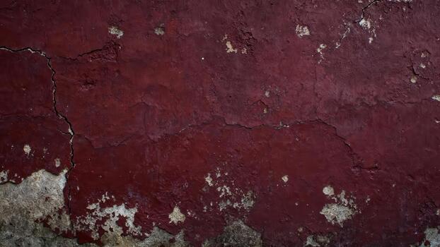 Weathered deep red painted surface exhibits significant cracking and peeling texture photo