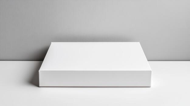 Blank white box on a table with a gray background photo