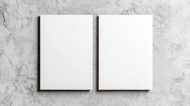 Two blank white sheets of paper on a wall photo