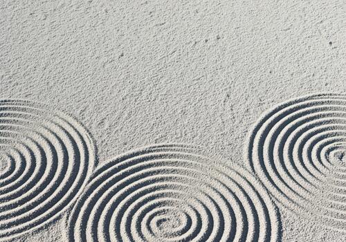 Pristine zen garden sand patterns displaying raked circular designs photo