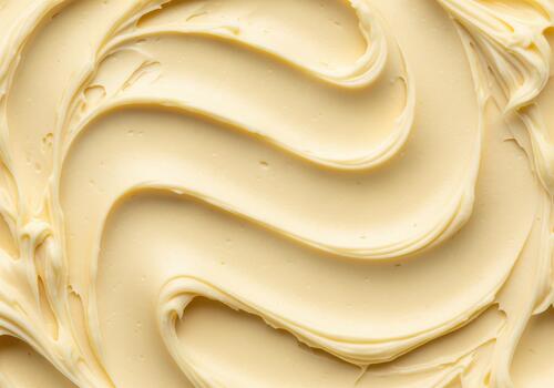 Rich creamy texture of whipped shea butter with elegant swirls photo