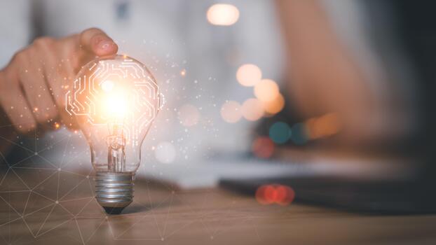 glowing light bulb digital brain circuit overlay symbolizes innovation, artificial intelligence, creative thinking, modern technology, representing fusion of human ideas ,advanced AI-driven solutions photo