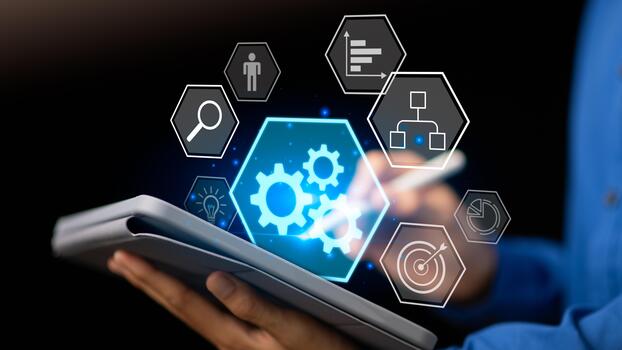 A businessman using a digital tablet with glowing gear and workflow icons, symbolizing process automation, business management, efficiency improvement, and innovation in corporate technology systems. photo