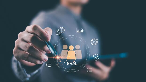 Businessman using a digital interface with CRM icon and data analytics symbols, representing customer relationship management, marketing strategy, and business data solutions ,Customer engagement photo