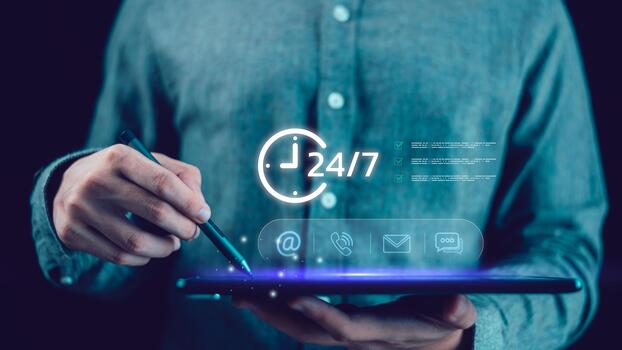 A person using a digital tablet with glowing 24-7 contact icons, symbolizing customer service, online communication, business support, and continuous digital connection in modern technology. photo