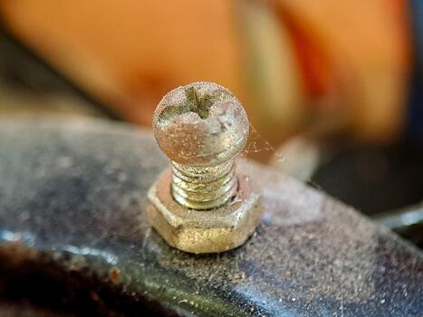 A weathered bolt and nut attached, hinting at sturdy connections and functional design use always. photo