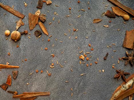 Scattered aromatic spices and herbs create a visually appealing culinary backdrop texture. photo