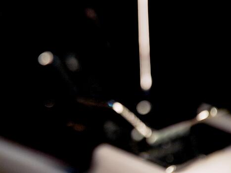 Abstract composition of diffused highlights and shadows creating a dynamic mood with dark tones. photo