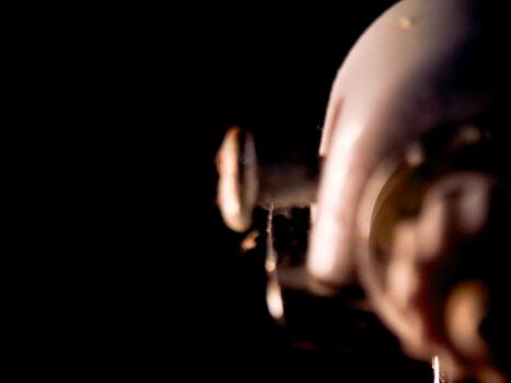 Abstract blurred image featuring soft lighting on an indistinct rounded form, dark background. photo