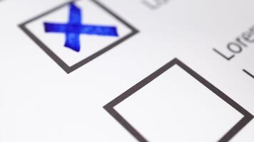 Cross mark drawn on paper symbolizing error, rejection, mistake, and disapproval. video