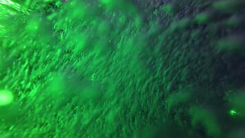 caotico movimento di colorato bolle nel piscina acqua con multicolore luci. astratto colorato sfondo video