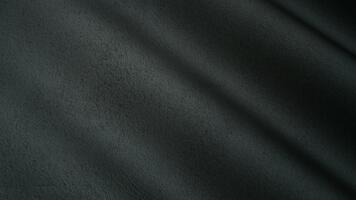 Coarse matte texture waves unfolding in deep charcoal tones enriched by an elegant layered abstract background environment video