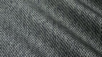 Microgrid woven texture waves shaping gray blend tones arranged within an exclusive geometric abstract background display video