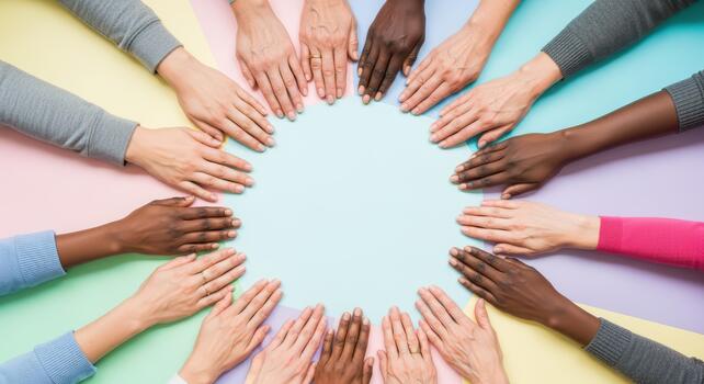 Diverse hands forming circle on colorful background symbolizing unity and inclusivity photo