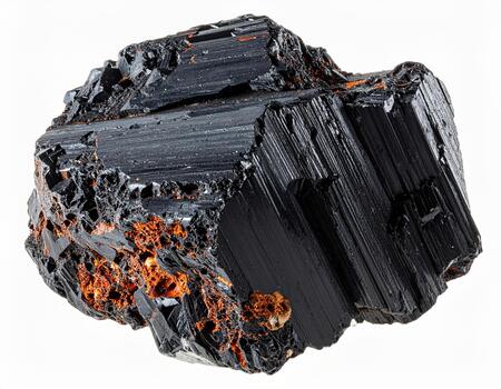 Black rough mineral rock with rusty orange patches and textured surface isolated on white background, showing natural crystalline structure and rugged details photo