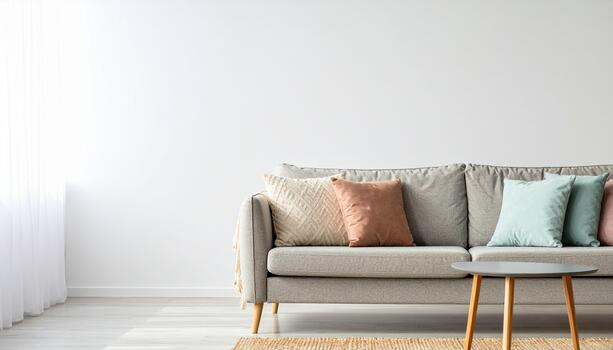 moderno vivo habitación caracteristicas gris sofá con vistoso cojines, redondo café mesa, y tejido alfombra en ligero de madera piso, creando acogedor y atractivo atmósfera foto