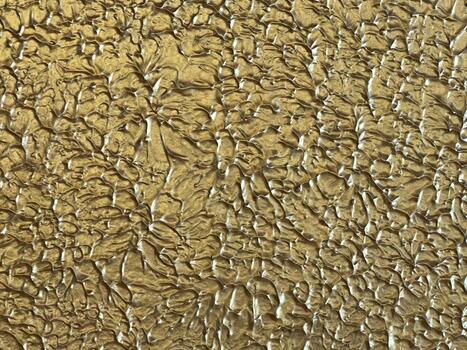 Golden Textured Surface with Irregular Relief. texture of stone wall. photo