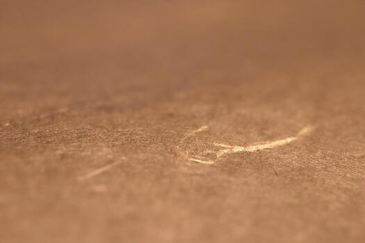 Close-up of a textured brown paper texture surface with subtle lighting. photo