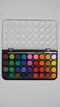 Palette of multi-colored eyeshadow on a white background photo
