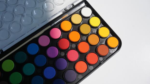Palette of multicolored eyeshadow isolated on white background photo