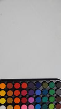 Multicolored eyeshadow palette isolated on a white background photo