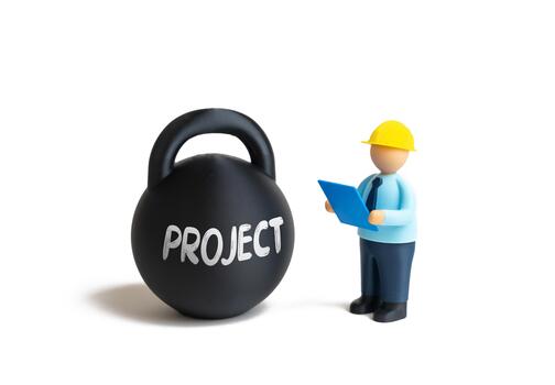 A builder with blueprints assesses the complexity of a project, a metaphor for a heavy weight. Engineering problems, the search for technological solutions. Construction risks. Project management. photo