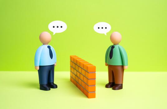 Two office workers engage in a dialogue, breaking down the barrier between them. Finding common ground. HR training, team building, and conflict resolution. photo