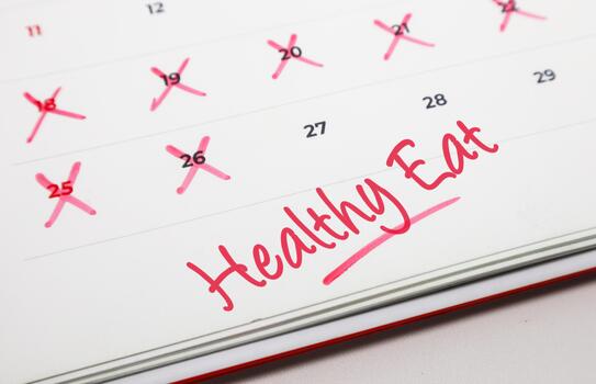 A visual representation of a healthy eating commitment on a calendar, marked for daily progress towards a nutritious diet and personal wellness journey photo